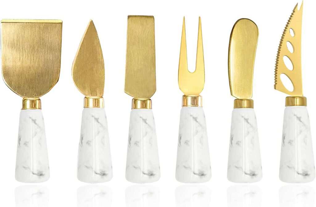 set coltelli formaggi marmo e oro